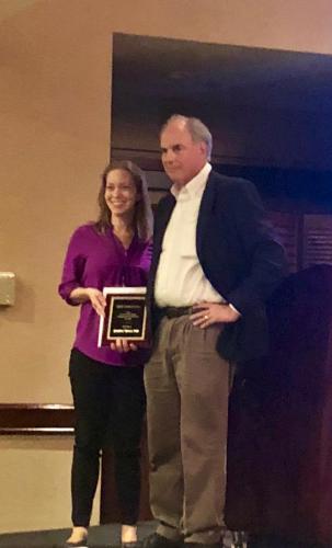Dr. Silvers receiving the ISDP's Kucharski Young Investigator Award