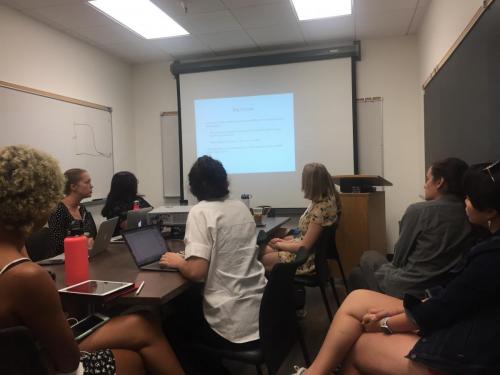 Dr. Silvers leading a professional development meeting for our RAs