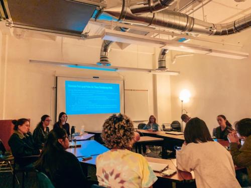 Natalie, Adriana, Yael, and Joao leading a professional development meeting for our RAs